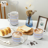 NFI essentials Set of 4 Ceramic Tea Cups With Stand Safe for the Microwave and Dishwasher Stackable Tea Cup  Printed Coffee Mugs for Gifting with Holder 150 ML - AYAHA ENTERPRISES PRIVATE LIMITED