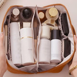 NFI essentials Cosmetic Travel Organizer Bag, Women's Makeup Pouch Toiletry Bag Portable Leather Wide Opening Cosmetics Bag with Handle and Divider - AYAHA ENTERPRISES PRIVATE LIMITED