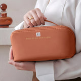 NFI essentials Cosmetic Travel Organizer Bag, Women's Makeup Pouch Toiletry Bag Portable Leather Wide Opening Cosmetics Bag with Handle and Divider - AYAHA ENTERPRISES PRIVATE LIMITED