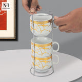 NFI essentials Set of 4 Ceramic Tea Cups With Stand Safe for the Microwave and Dishwasher Stackable Tea Cup  Printed Coffee Mugs for Gifting with Holder 150 ML - AYAHA ENTERPRISES PRIVATE LIMITED