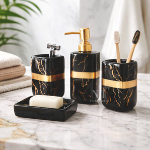 NFI essentials Ceramic 4 Piece Bathroom Accessories Set, Soap Dispenser, Toothbrush Holder, Tumbler & Soap Dish For Washroom Decor And House Warming Gift (Black & Gold)