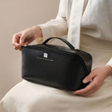 NFI essentials Cosmetic Travel Organizer Bag, Women's Makeup Pouch Toiletry Bag Portable Leather Wide Opening Cosmetics Bag with Handle and Divider - AYAHA ENTERPRISES PRIVATE LIMITED