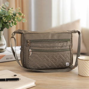 NFI essentials Sling Bag for Women, Multi Pocket Crossbody Bag for Travel