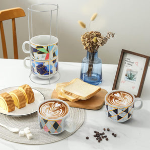 NFI essentials Set of 4 Ceramic Tea Cups With Stand Safe for the Microwave and Dishwasher Stackable Tea Cup  Printed Coffee Mugs for Gifting with Holder 150 ML