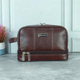 Brown leather toiletry bag with double zip compartments for men’s travel grooming