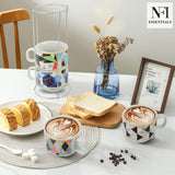 NFI essentials Set of 4 Ceramic Tea Cups With Stand Safe for the Microwave and Dishwasher Stackable Tea Cup  Printed Coffee Mugs for Gifting with Holder 150 ML - AYAHA ENTERPRISES PRIVATE LIMITED