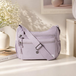 NFI essentials Sling Bag for Women, Multi Pocket Crossbody Bag for Travel