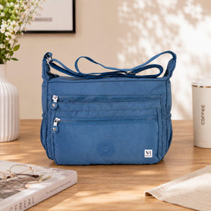 NFI essentials Sling Bag for Women, Multi Pocket Crossbody Bag for Travel (Blue)