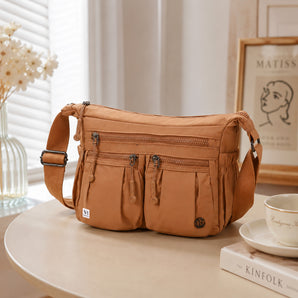 NFI essentials Sling Bag for Women, Multi Pocket Crossbody Bag for Travel