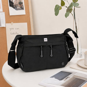 NFI essentials Sling Bag for Women, Multi Pocket Crossbody Bag for Travel