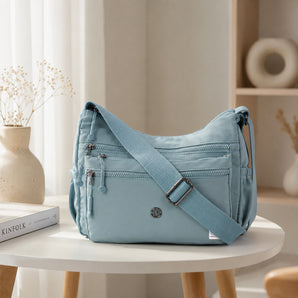 NFI essentials Sling Bag for Women, Multi Pocket Crossbody Bag for Travel